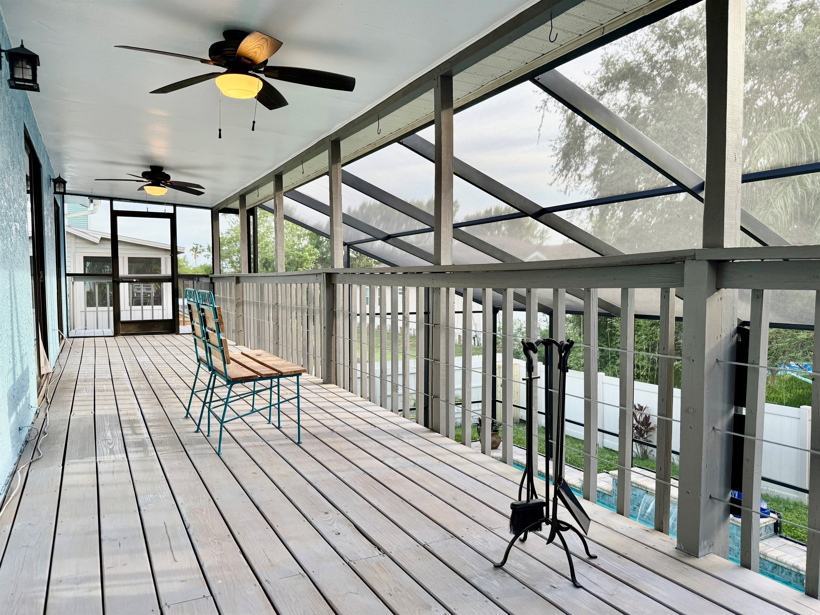 Two overhead ceiling fans ensure a cool, breezy ambiance throughout the day — whether you're lounging in the sun or enjoying a shaded afternoon escape.