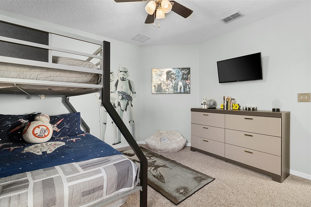 Single over double bunk in the Star Wars room.