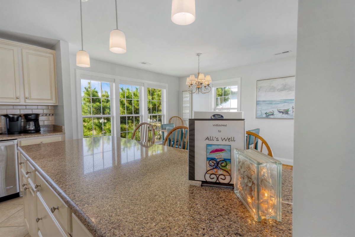 The large bar is accessible from 3 sides. So, everyone can help with meals.