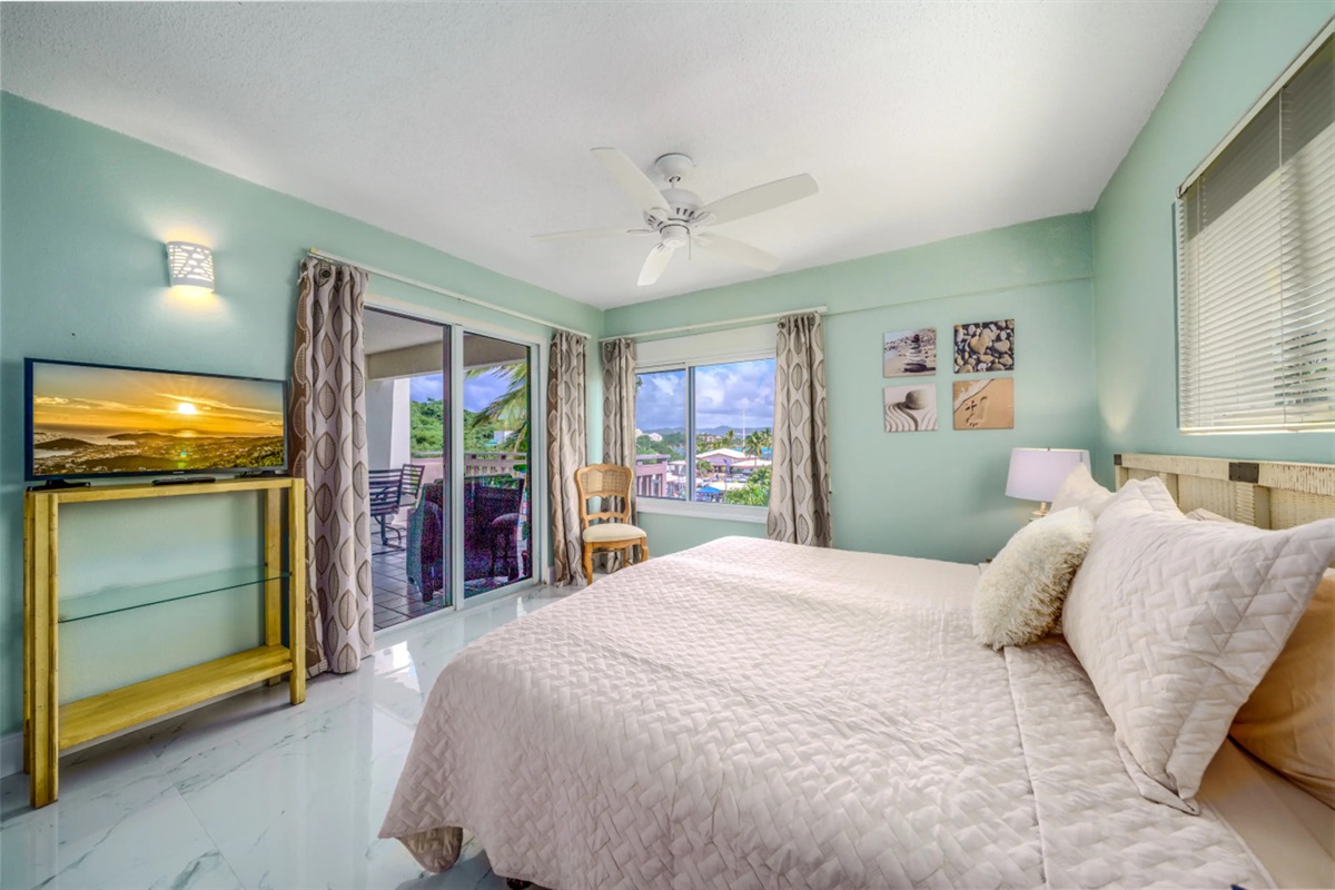 Relax and unwind in the spacious primary bedroom designed for comfort and tranquility.