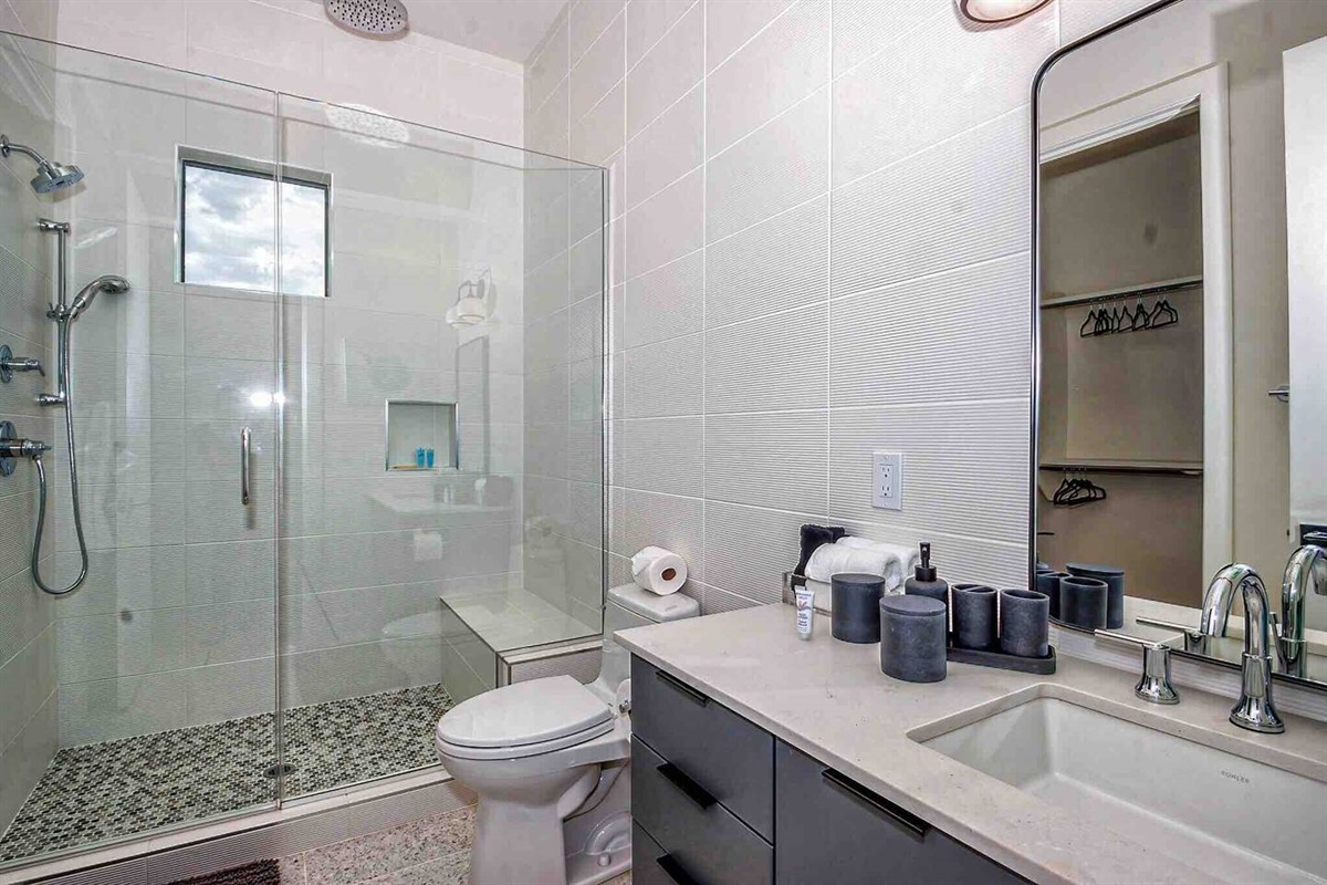 Walk in all glass shower with 3 shower heads -including a rain shower!