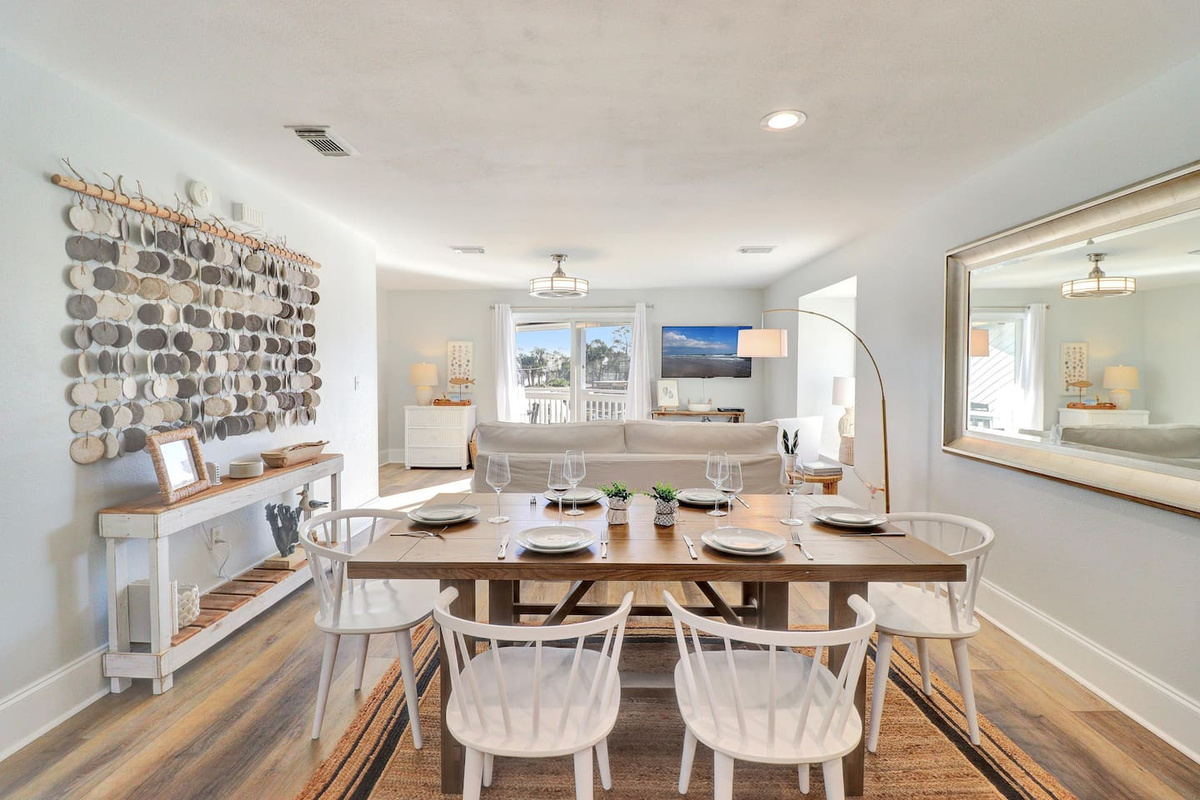  Gather your group &mdash; the open-plan layout flows from kitchen to couch to water view.