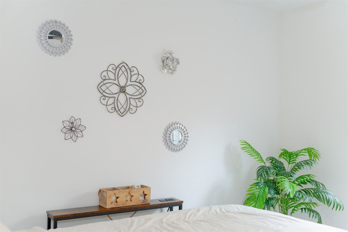 Neutral decor with soft accents creating a calming vibe.