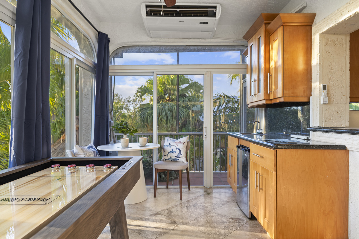 Enjoy a seperate wet bar off the back sun room.