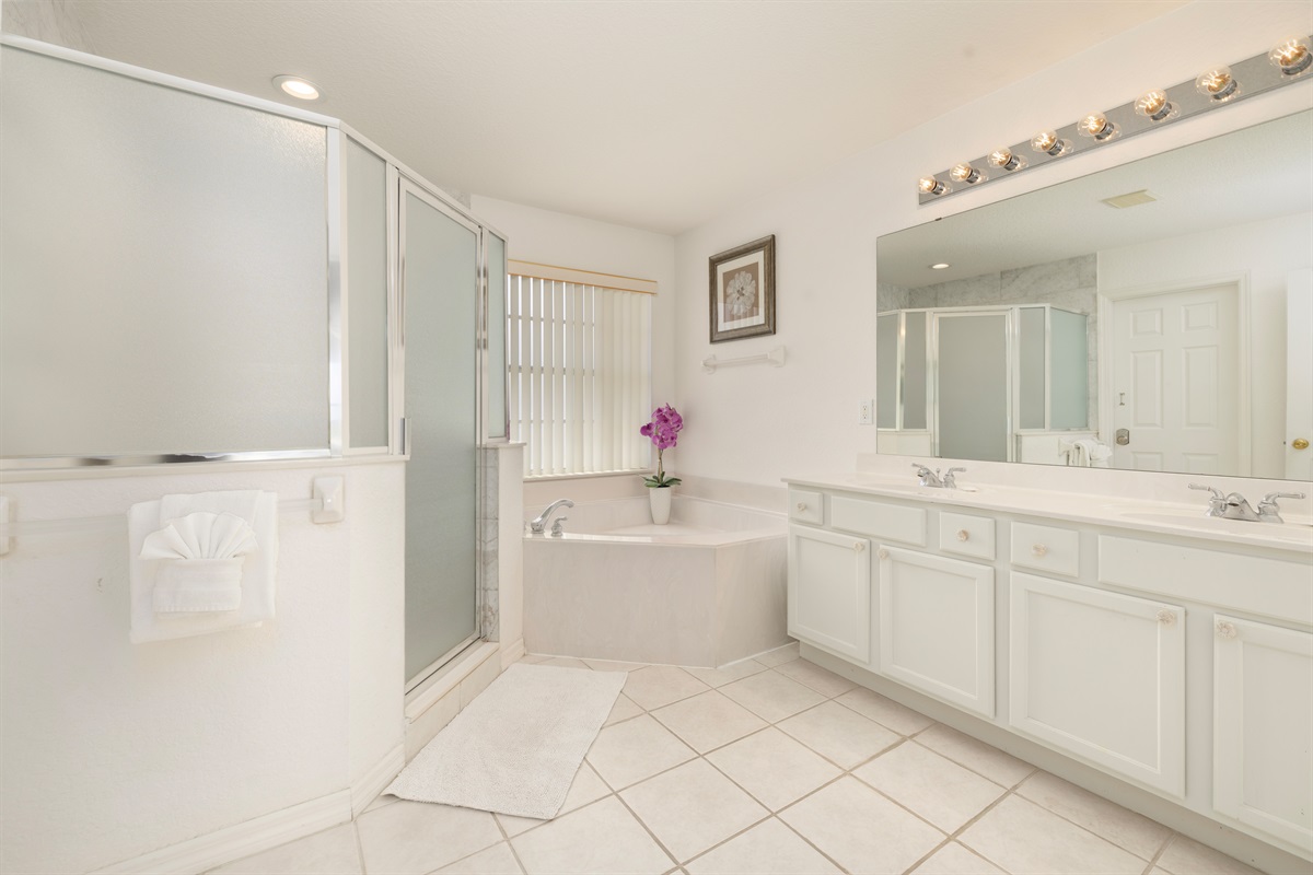 The king master bath has lots of light and double sinks for convenience.