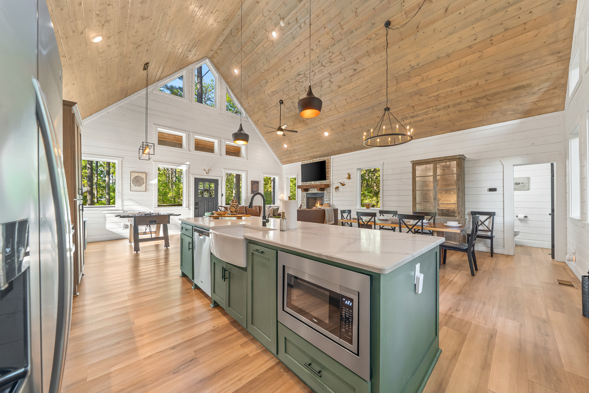 The open-concept main pod keeps cooking, dining, and relaxing together at the heart of the house.