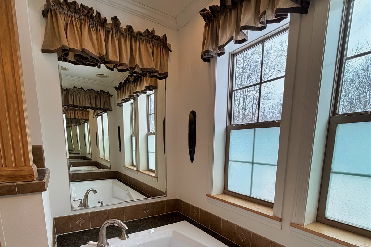 Primary bathroom with jetted tub and shower.