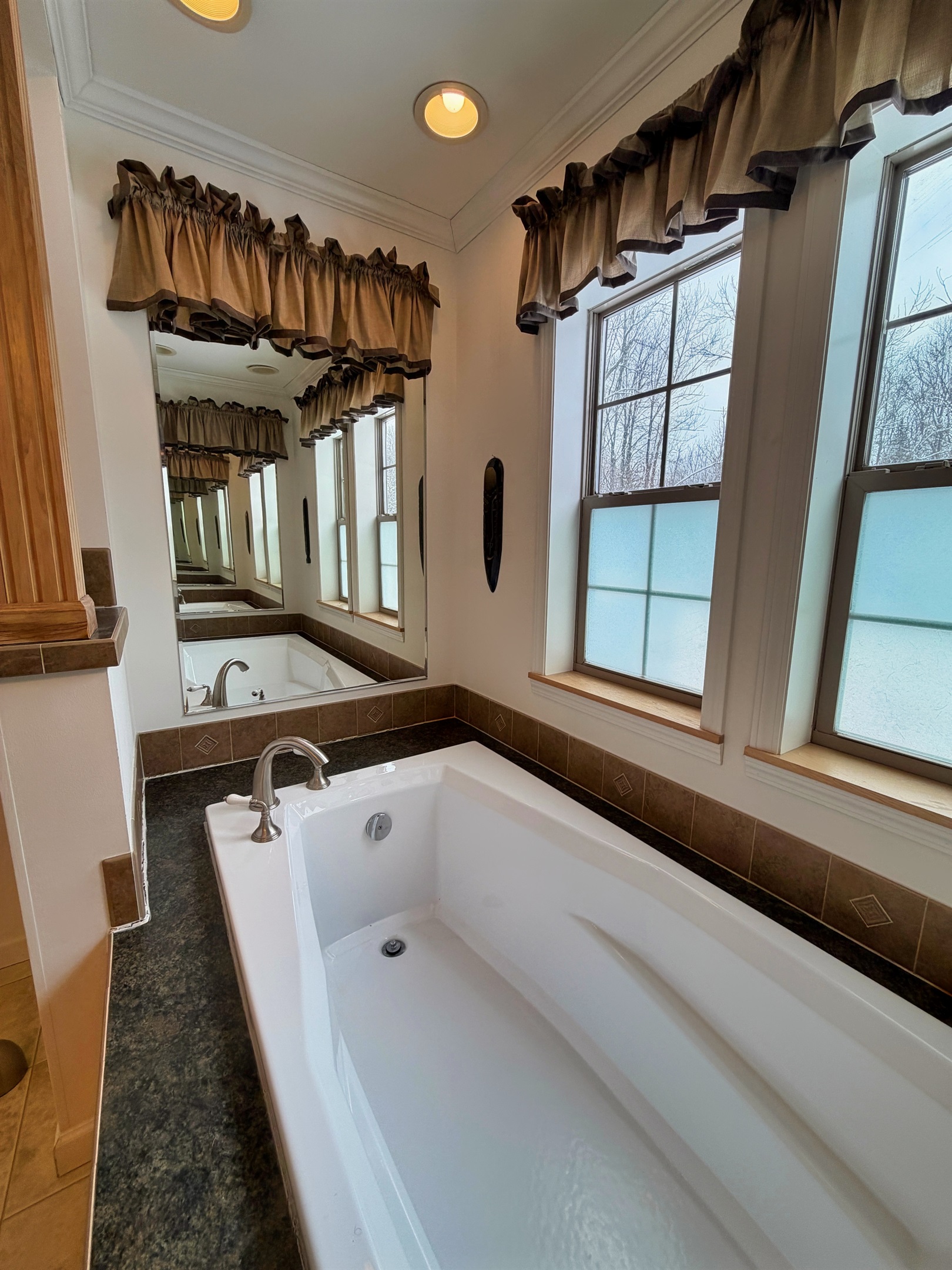Primary bathroom with jetted tub and shower.