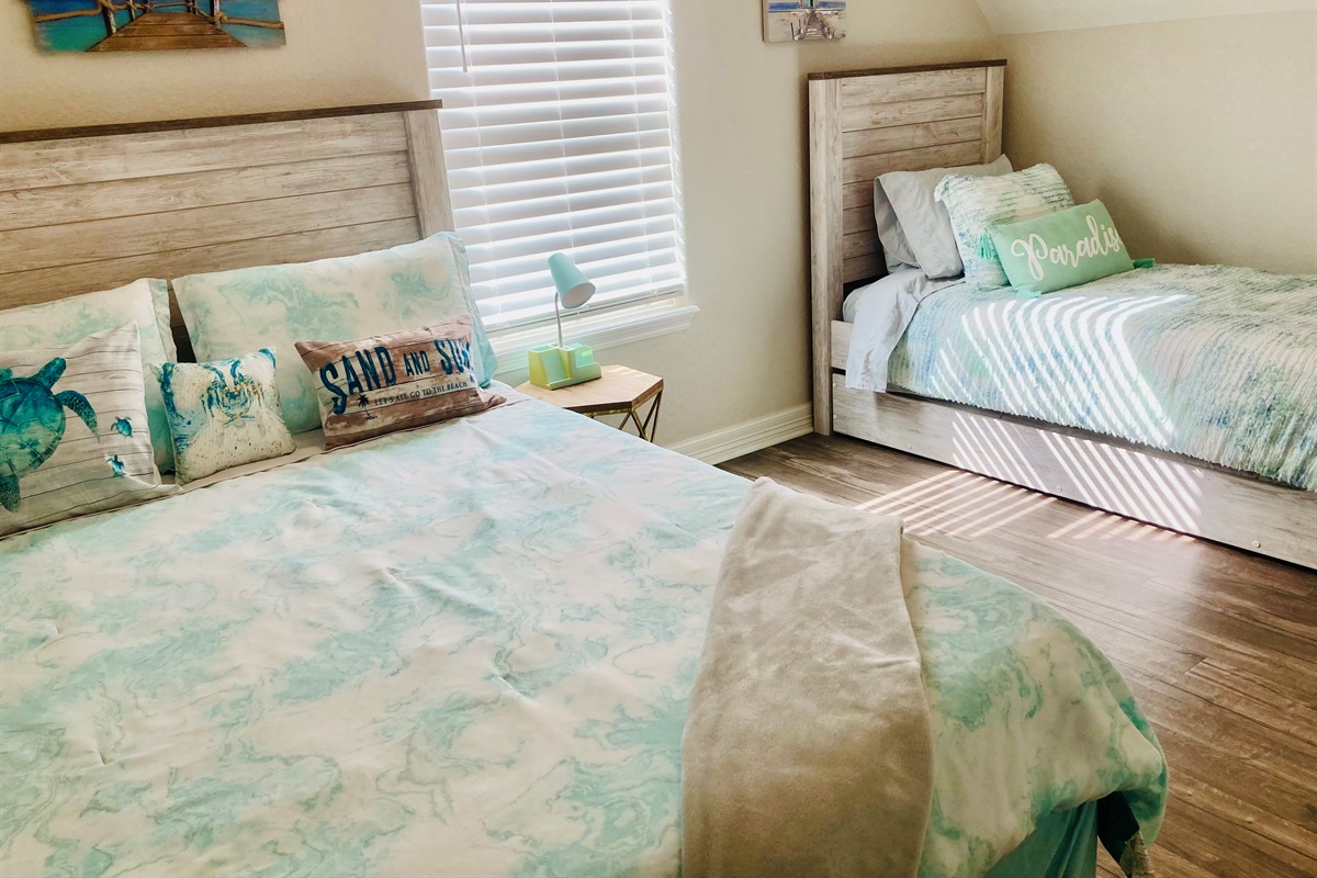 Bedroom 2 upstairs with queen and twin with twin trundle