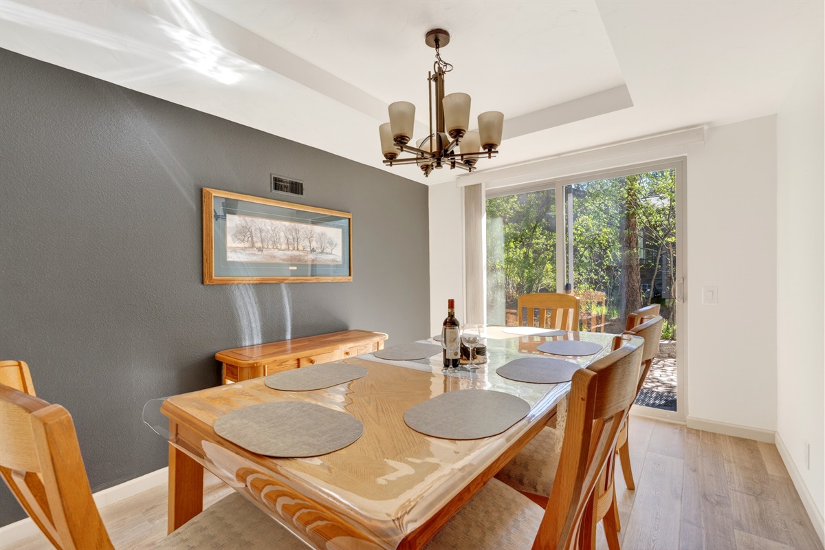 The dining room offers comfortable seating for eight, creating a welcoming space for shared meals, conversations, and memorable gatherings.