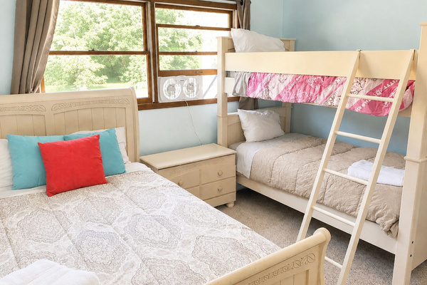 Great for kids, cousins, or friends traveling together, this room offers a full bed and twin bunk beds.