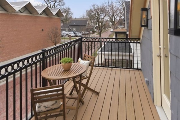Private balcony with cozy seating, perfect for enjoying fresh air and city views