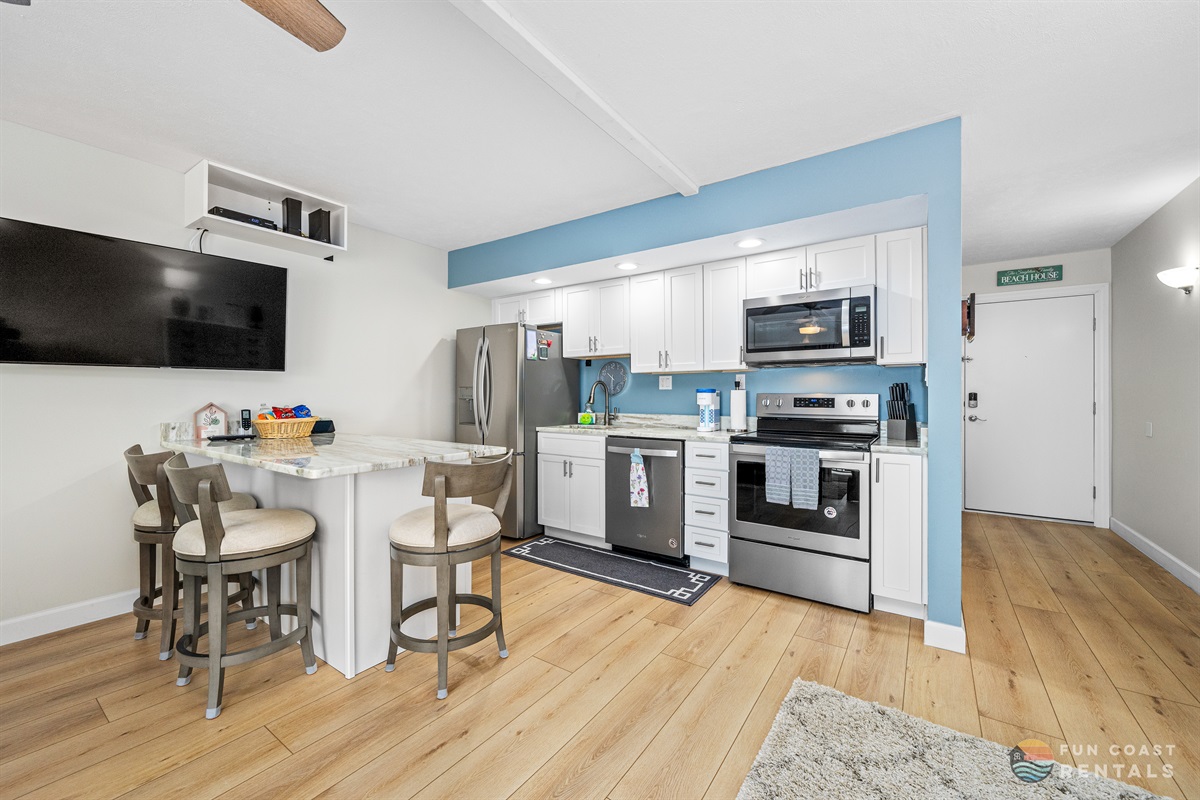 Fully-Equipped Stainless Steel Kitchen and Counter Seating