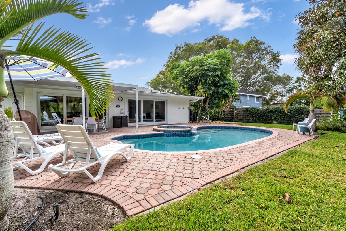 Heated Upgraded Saltwater Pool and Hot tub! Covered Patio Table! Sunning lounge chairs, BBQ Grill and lots of green space to play!