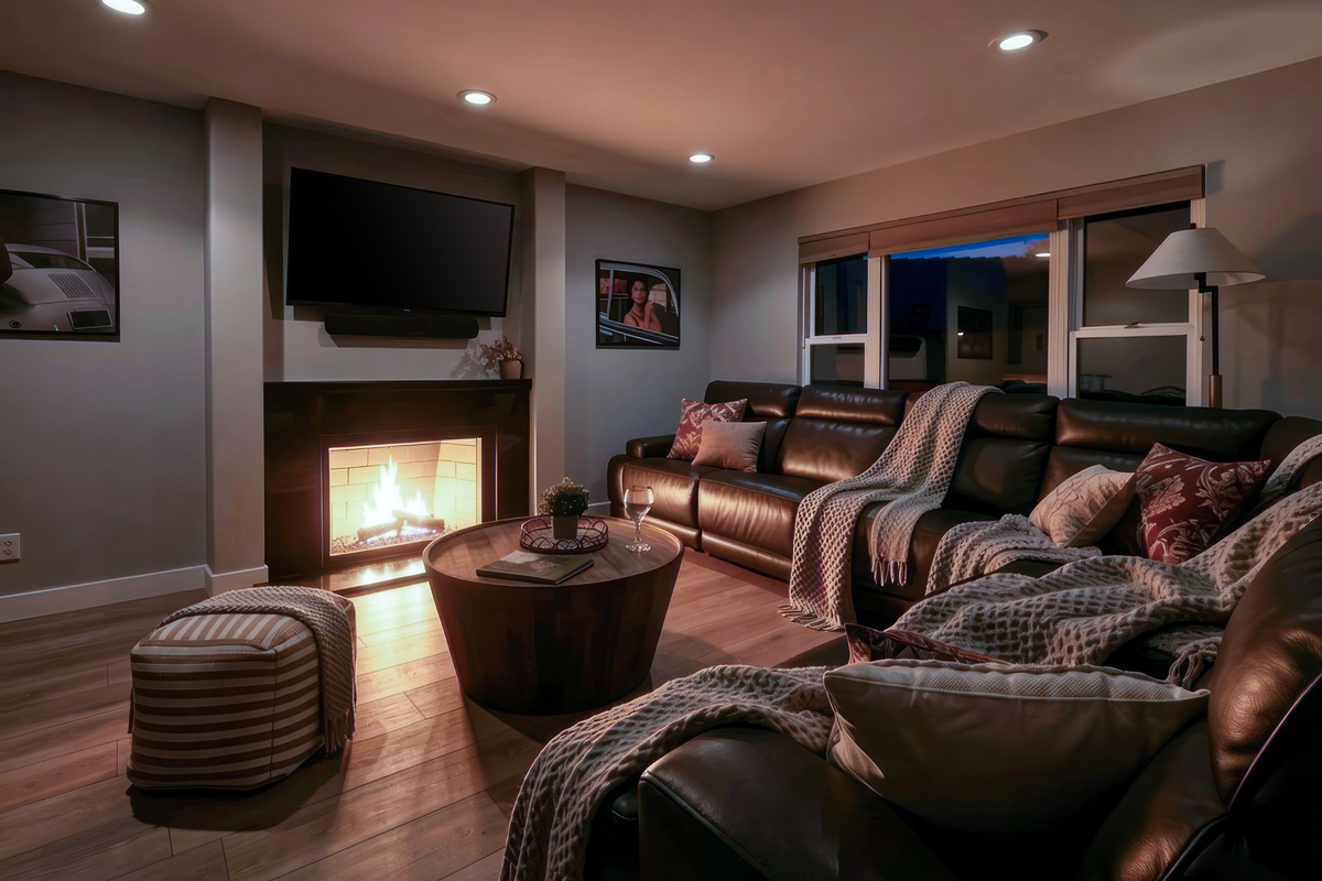 Enjoy a movie or a fire at the gas fireplace on the reclining sectional