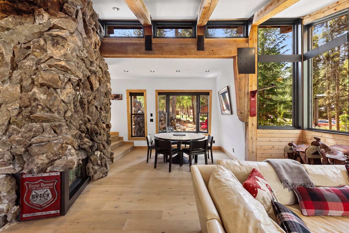 Vaulted ceilings with a soaring rock fireplace is the center of the home. 