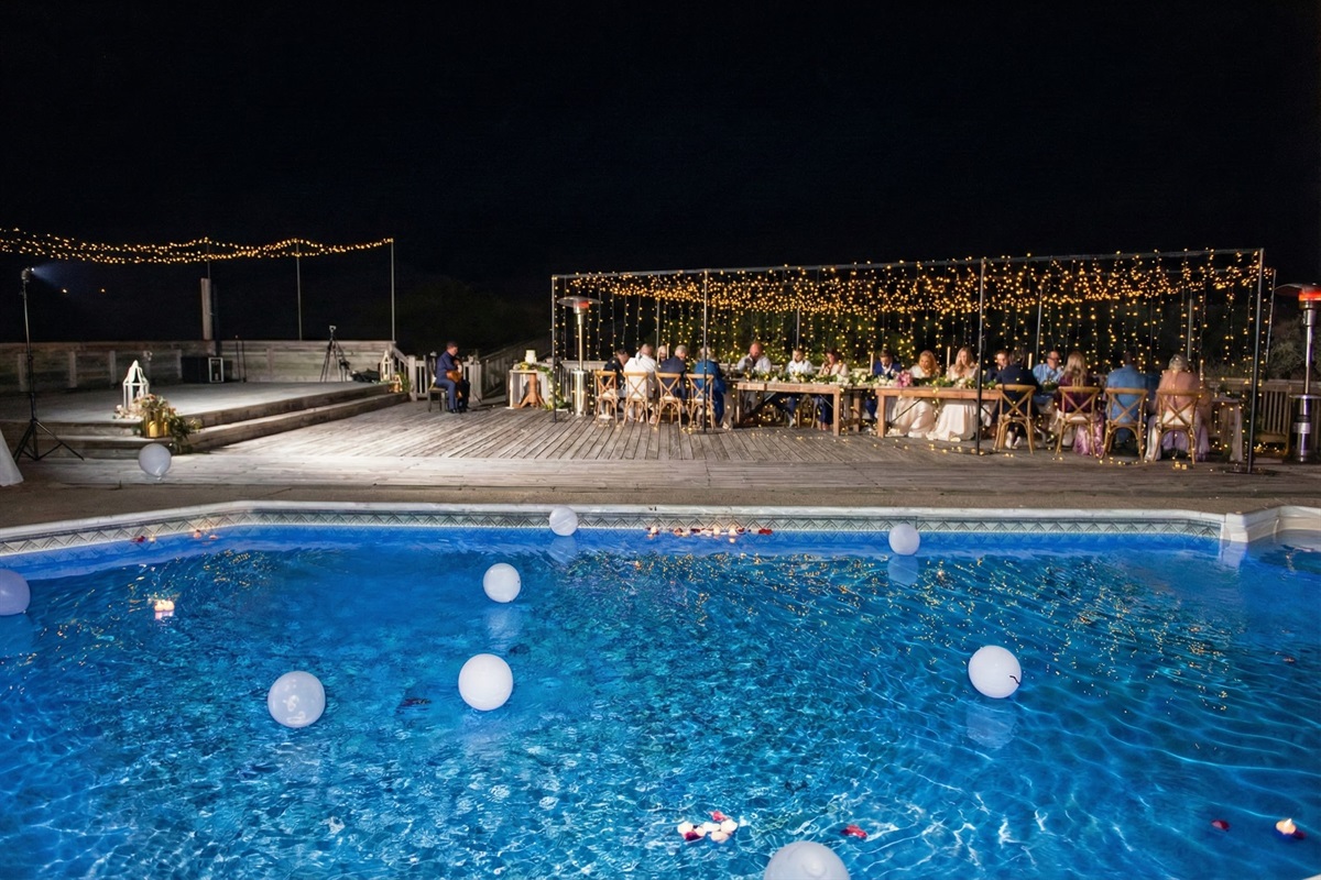 The pool deck transforms into a magical reception venue at night. Featuring plenty of space for dining tables, a dance floor, and ambient lighting setups for unforgettable evenings.