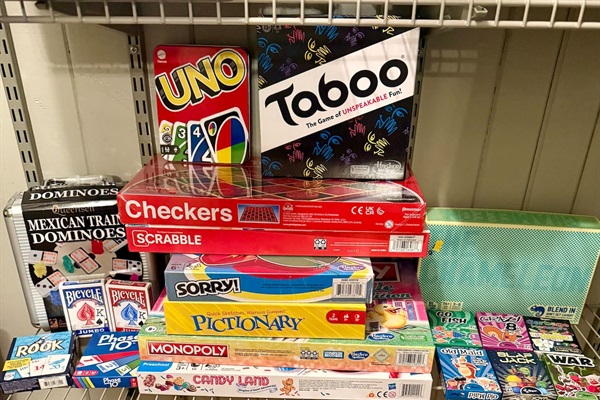 Game closet packed with family favorites, including board games, card games, and classics for all ages—perfect for cozy nights in, rainy days, or friendly competition after exploring Pigeon Forge.