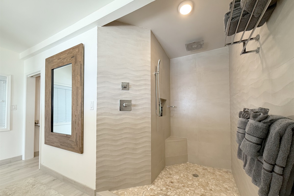 Rainfall shower for a spa-like experience.