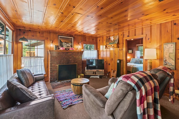 Another view of the living room, inviting you to sit back, relax, and enjoy the cabin’s peaceful charm.