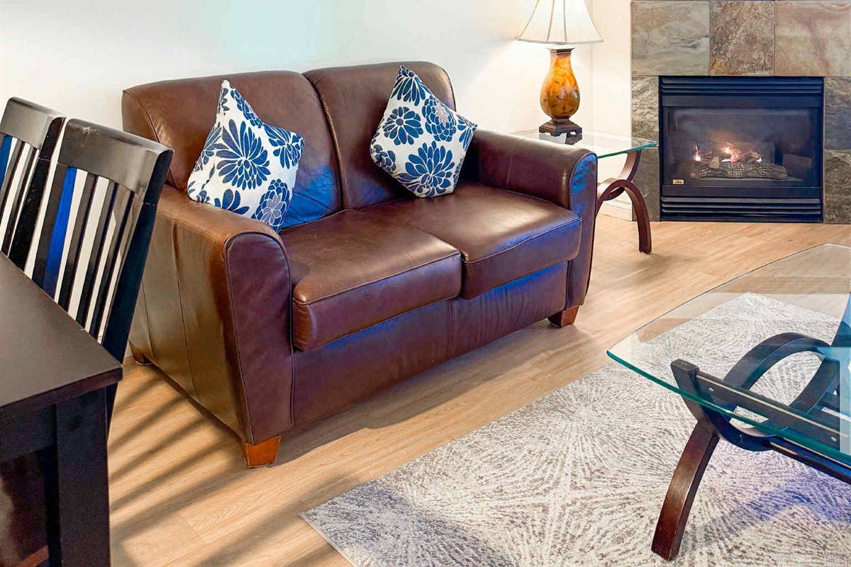Unit A Couch and natural gas Fireplace.