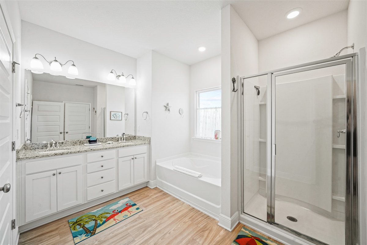Dual sinks, tub and a walk-in shower perfect for busy mornings