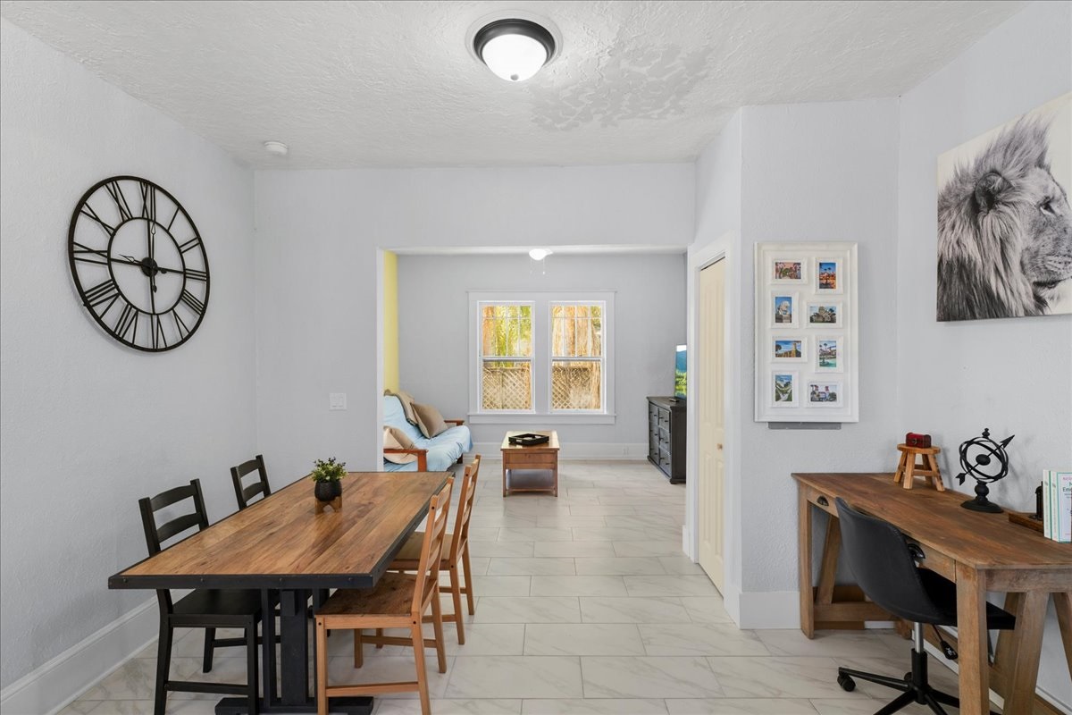 Dining room seating, open living area with couch and desk so everyone can be together but have plenty of space to spread out!