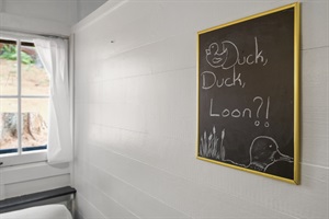 Chalk board with duck duck , loon?