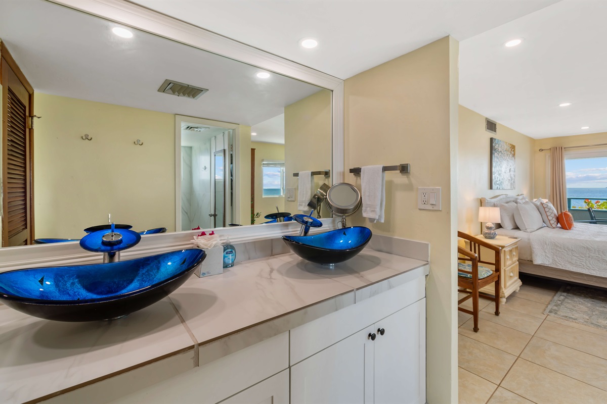 Ensuite bathroom with double sinks just off the primary bedroom
