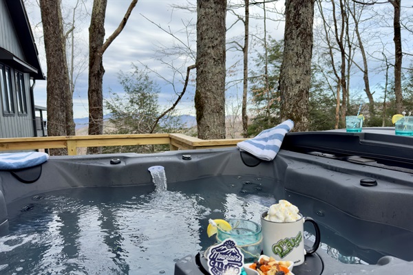 Submerge in the hot tub and soak in the breathtaking view. And maybe see a few deer walking by...