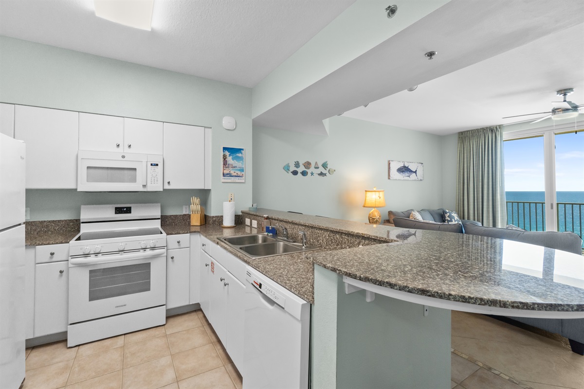 We have a full kitchen with marble counter top, cabinets, refrigerator, stove, microwave, dishwasher, and more!