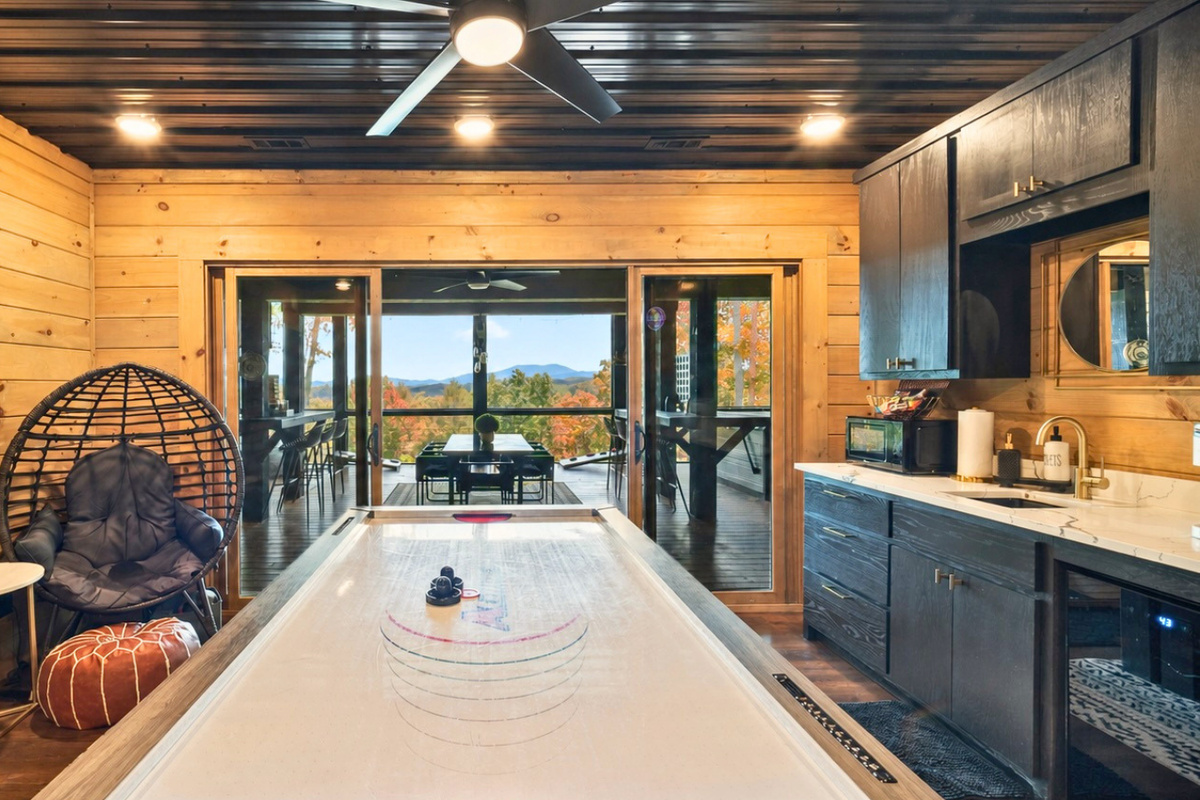This stylish recreation area invites friendly competition with a full-size air-hockey table.