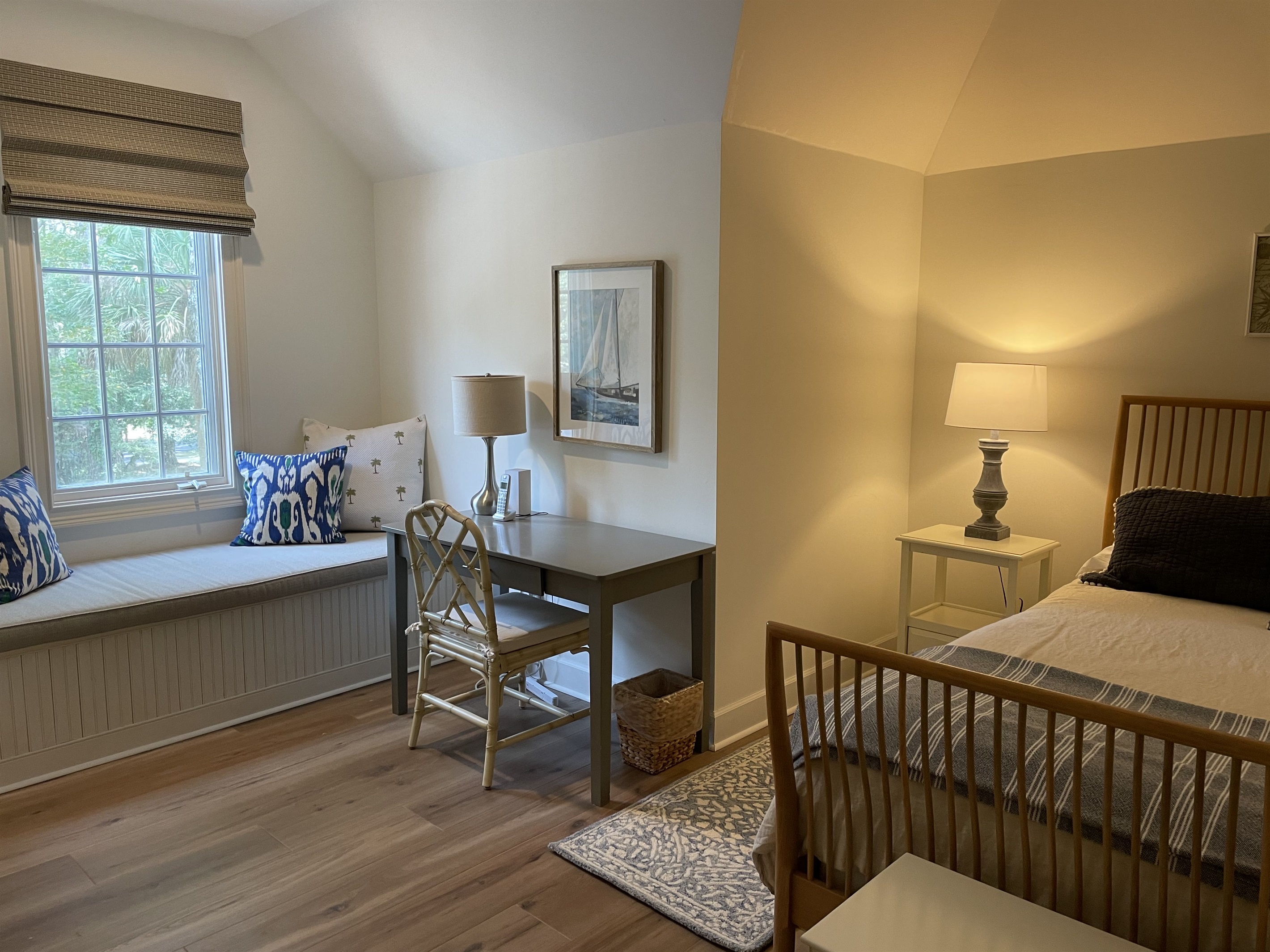 King bedroom with window seat overlooking front yard