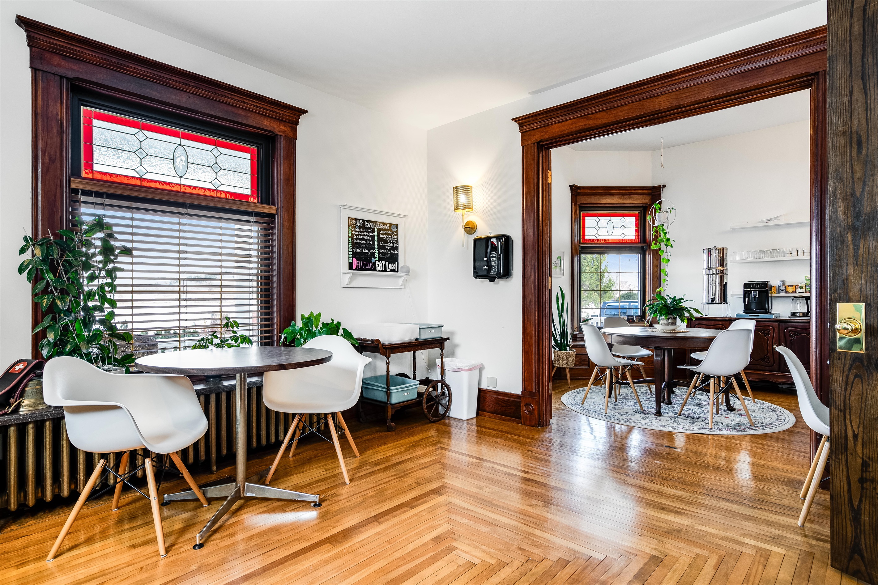 Multiple seating areas in the shared breakfast area.