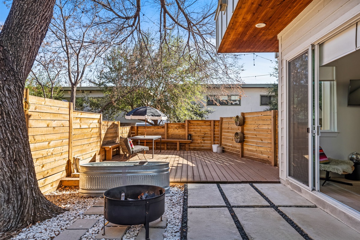 Inviting courtyard featuring a fire pit and easy access to indoor living spaces
