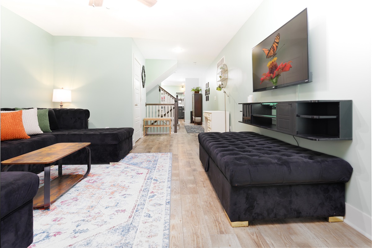 Open-concept main living area thoughtfully designed for seamless flow between the living room, dining space, and kitchen.
