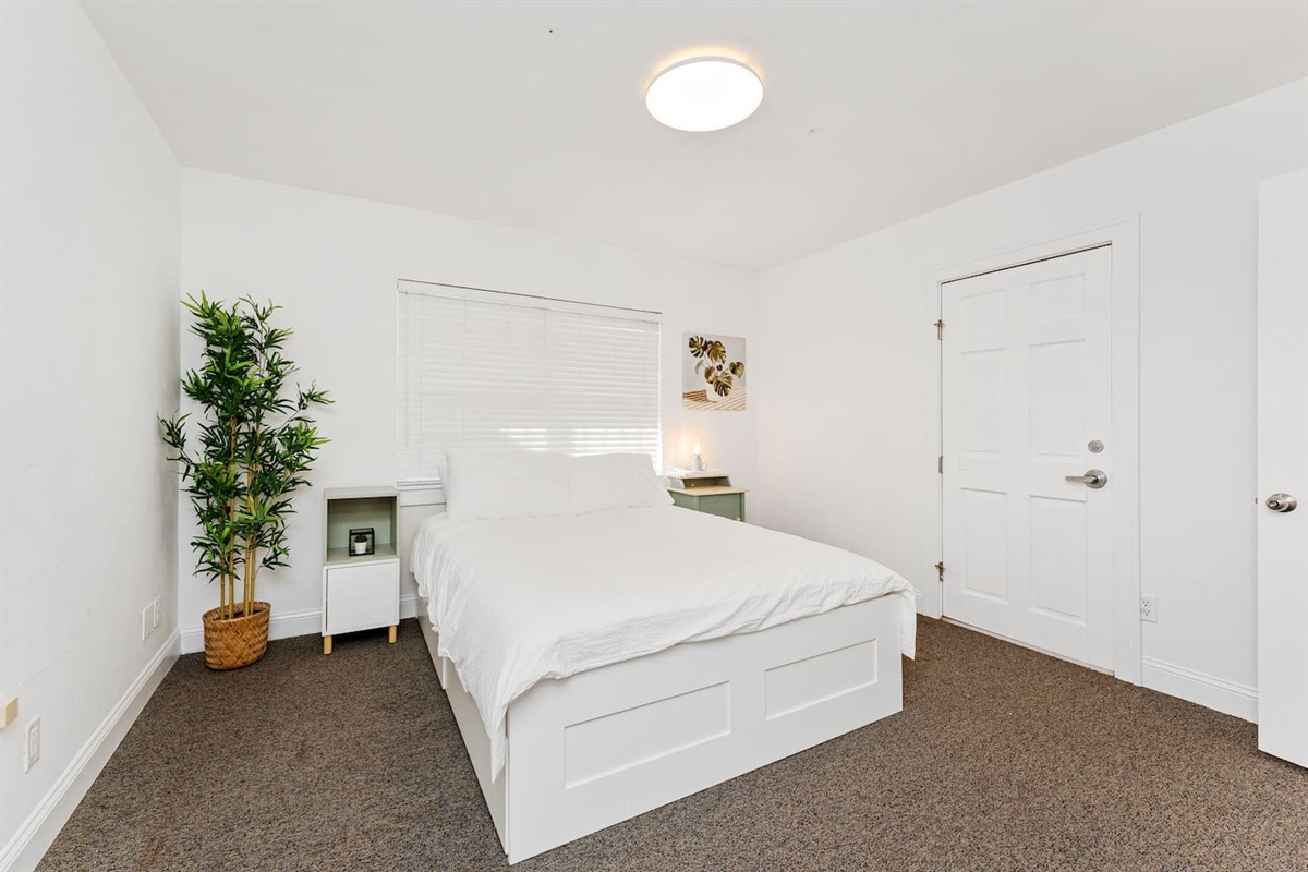 Bright master bedroom w/ queen bed for slow, easy mornings