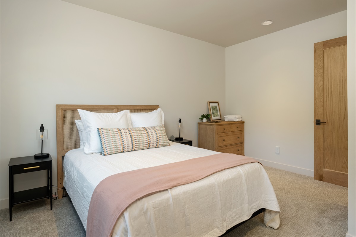Your downstairs retreat: queen bed + private bathroom