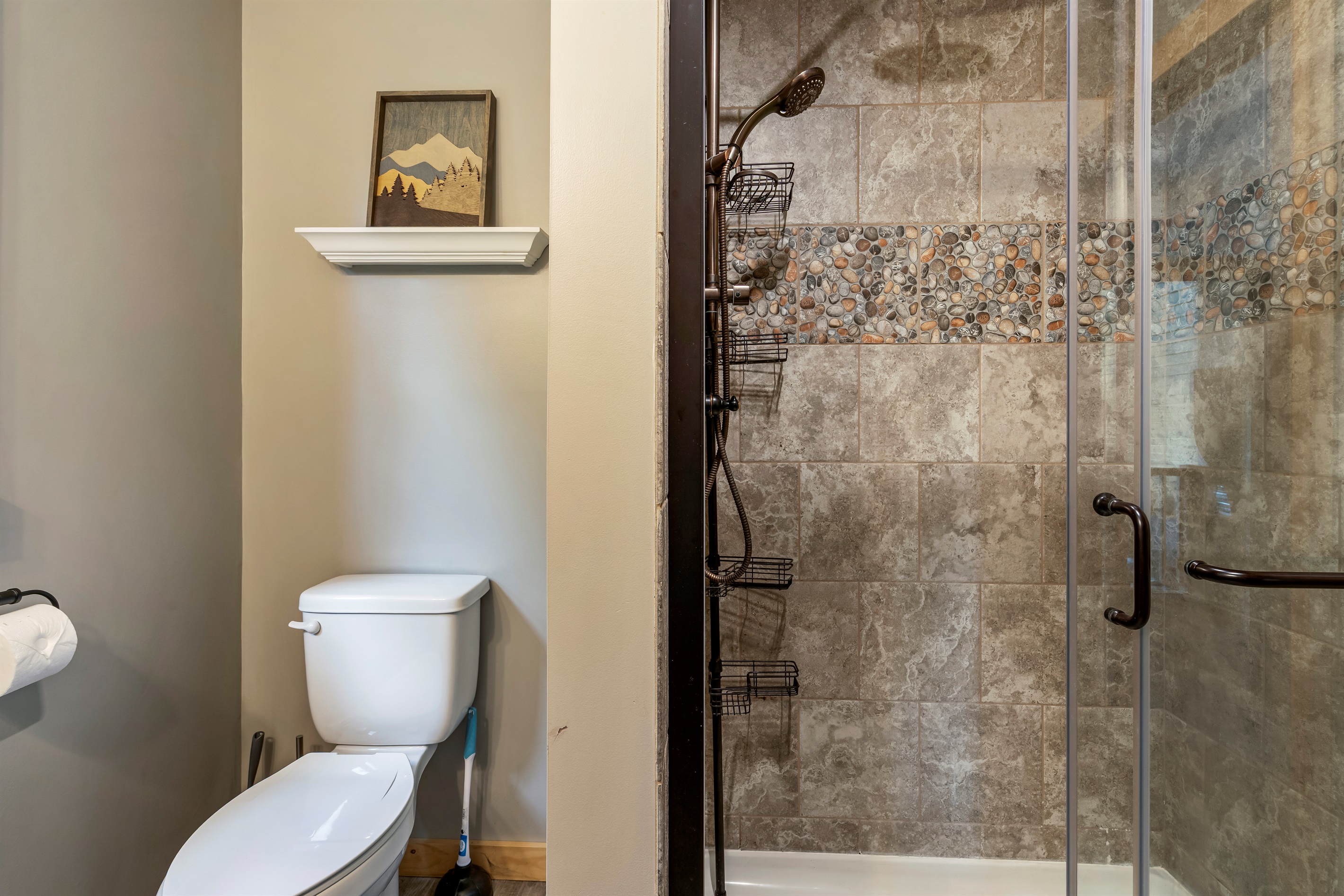 Ensuite bathroom with walk-in shower and modern finishes.