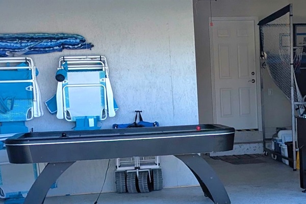 Enjoy foosball, basketball, and air hockey in the garage game room. EV charger available.