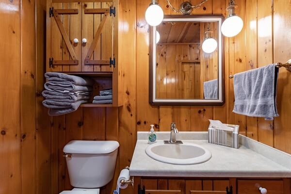 Bathroom 1 is located near the 2 main floor bedrooms on the lakeside.