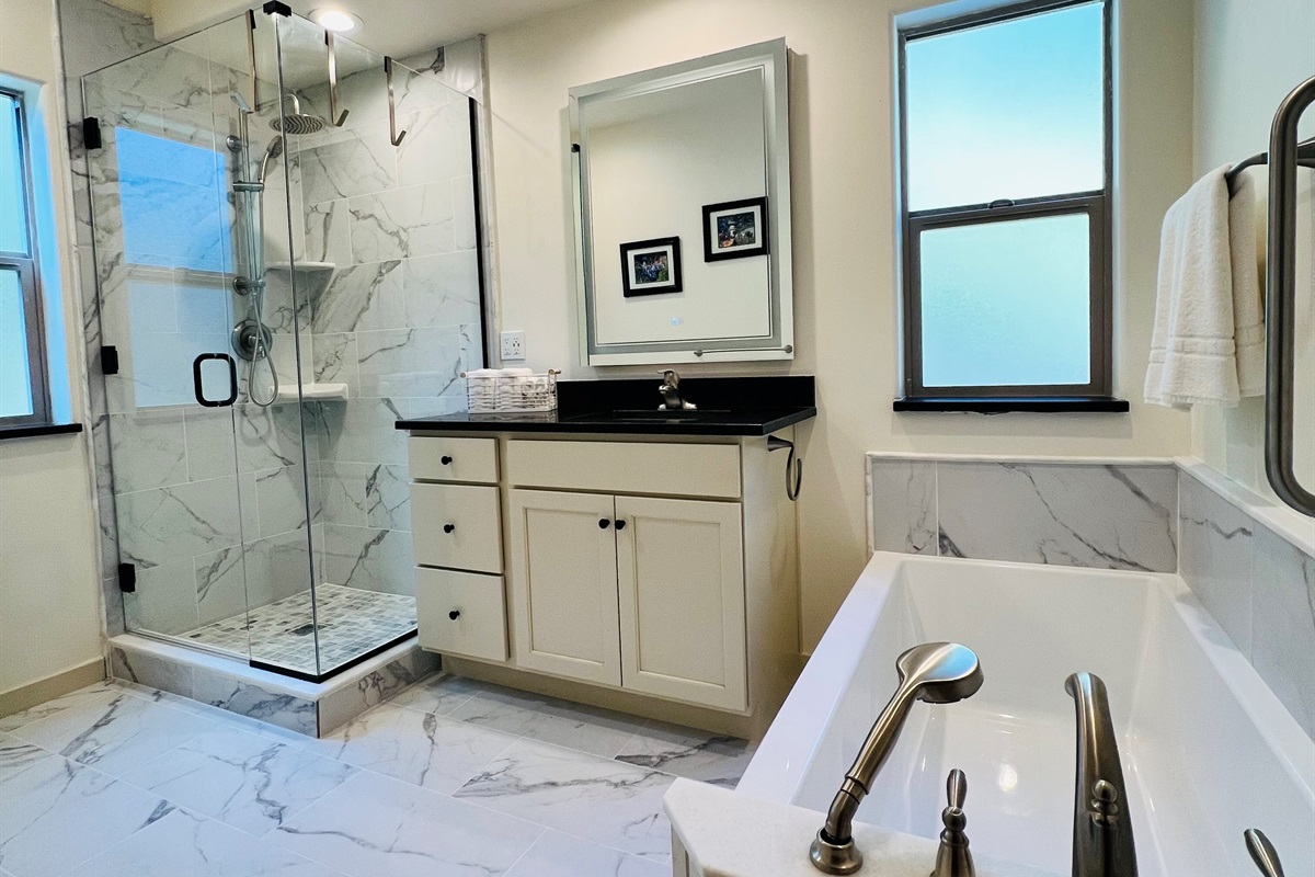Beautiful, deep soaking tub with hand-held showerhead makes washing your hair in the bathtub easy.  Always nice after a day of hiking, biking or sightseeing.