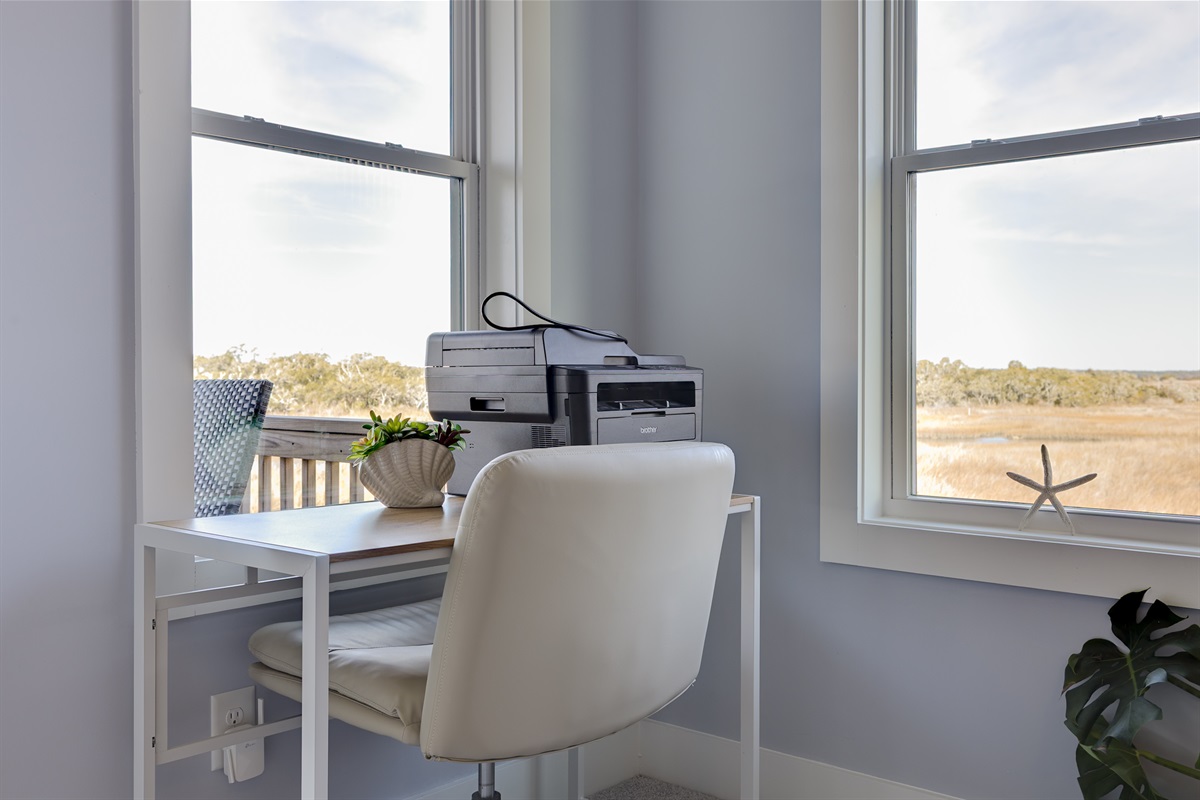 A bright, quiet workspace with Sound views&mdash;perfect for catching up on emails or remote work between beach days