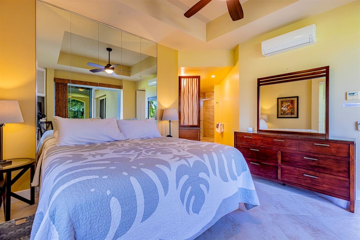 the main bedroom features a Cal-king bed, A/C and an attached private bathroom