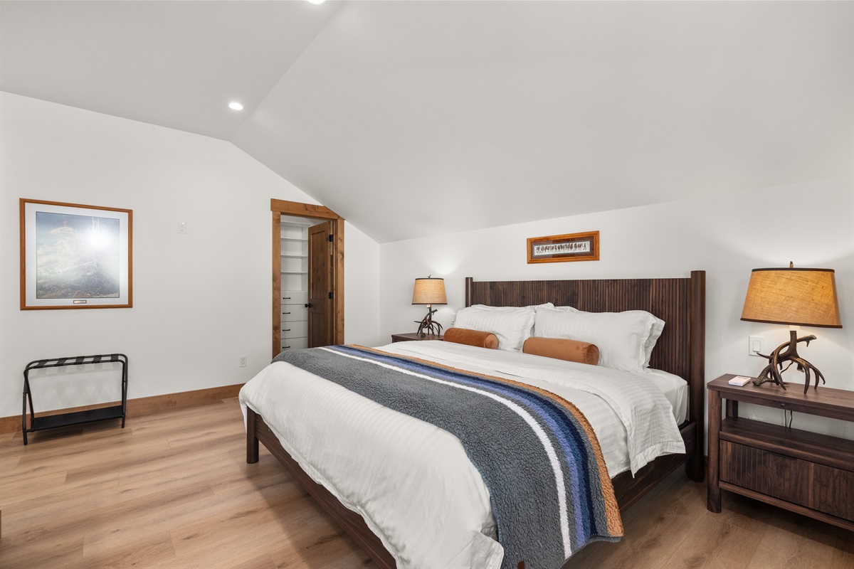 King bed in loft bedroom.
