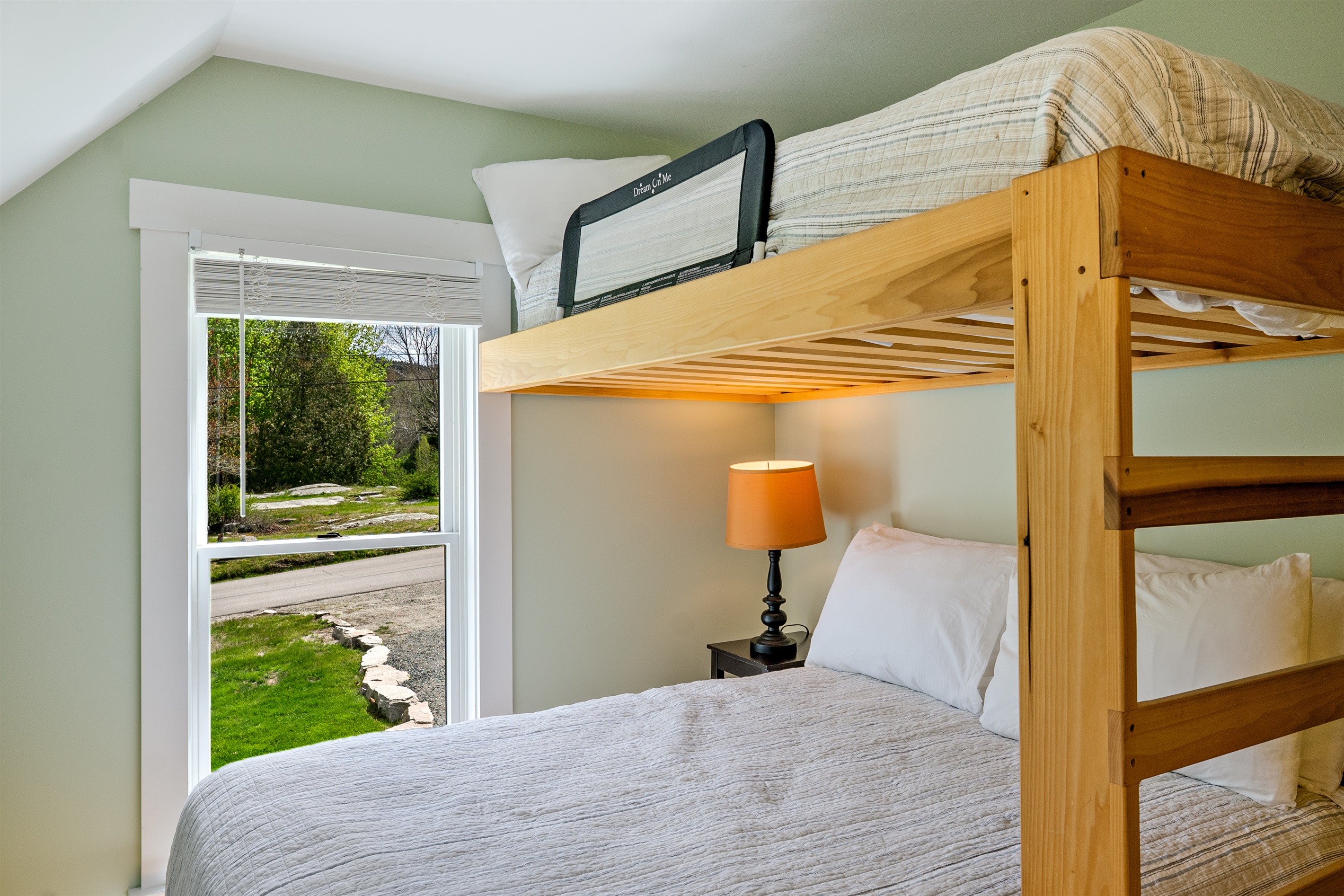 Rest up in the Acadia Room. This twin-over-full bunk features integrated safety rails for a secure night's sleep. Named for the nearby mountain peak, this bright Hall Quarry bedroom is a cozy, quiet retreat for your MDI adventure group.