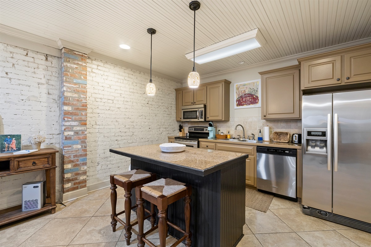 Original exposed brick that showcases the building’s historic charm.