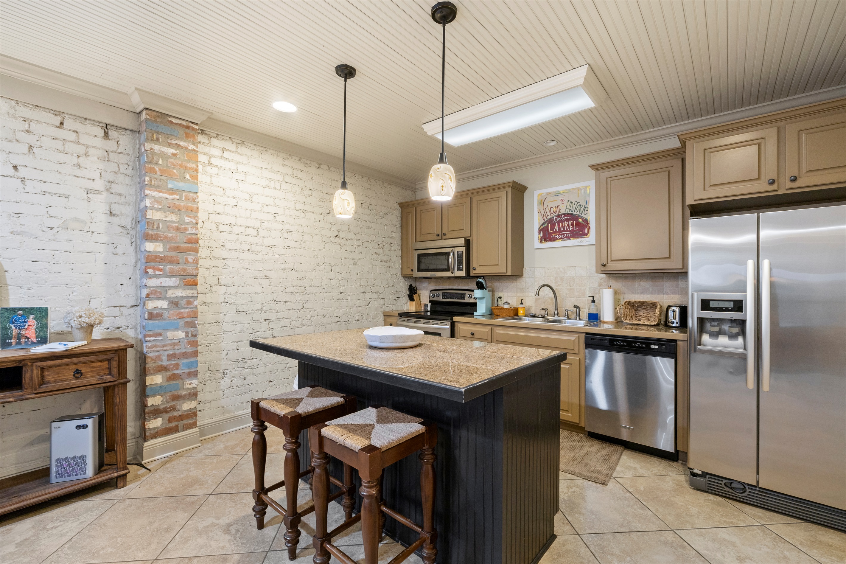 Original exposed brick that showcases the building’s historic charm.