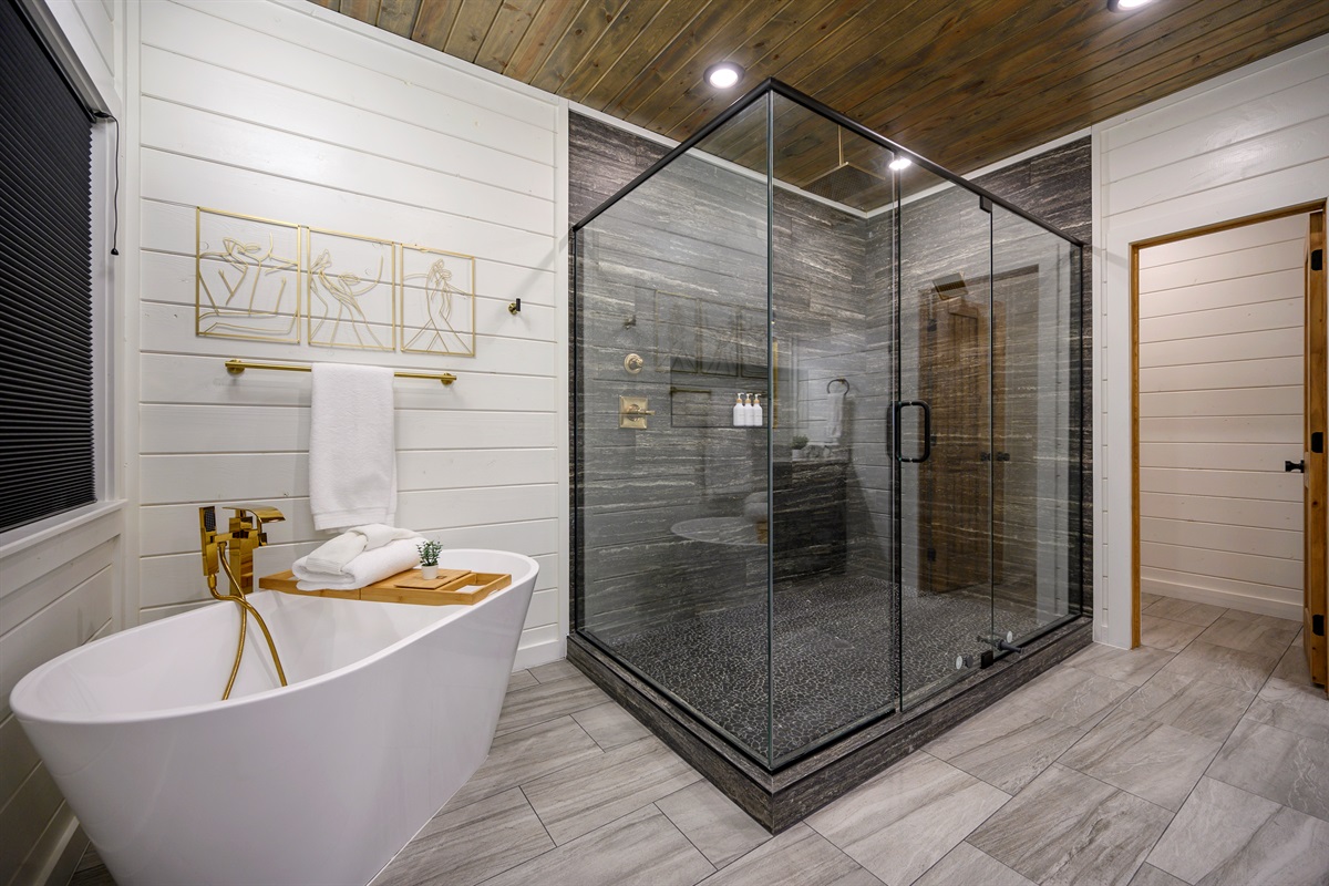 A spa-inspired full bathroom featuring a relaxing bathtub, walk-in shower, bathtub tray for slow self-care evenings, and thoughtfully provided bathroom essentials to make your stay feel comfortable and effortless. 🛁