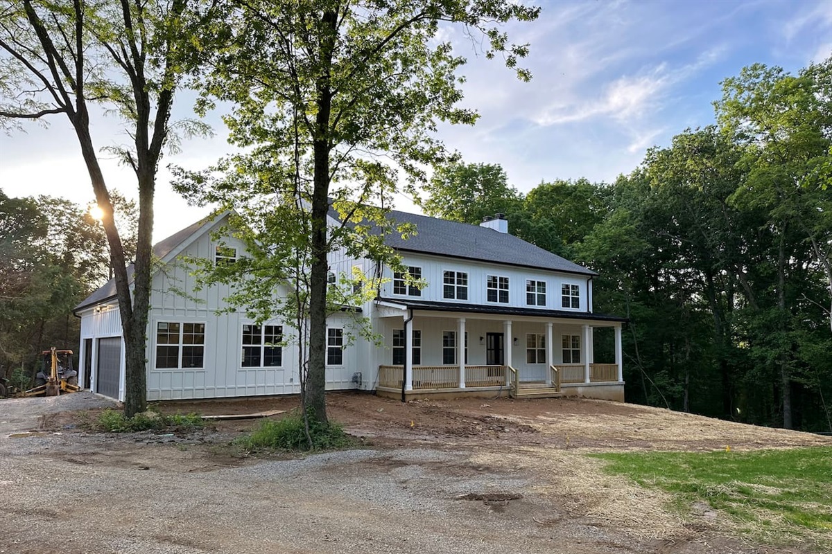 The home sits on 22 acres of land, nestled right alongside Floyd's Fork Creek. Enjoy a spacious open backyard, gorgeous wooded trails, open fields, and creek access. Photo taken spring of 2024 when grass was just coming in.
